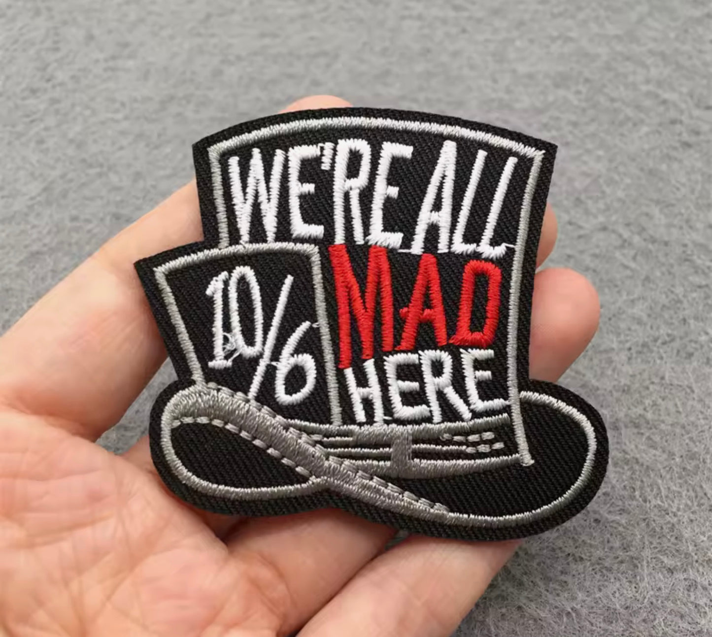 “We’re All Mad Here” Embroidered Iron-On Patch